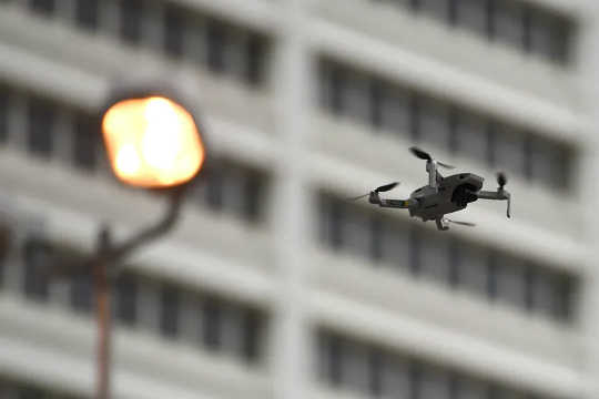 A law enforcement drone flew over demonstrators, Friday, June 5, 2020, in Atlanta.