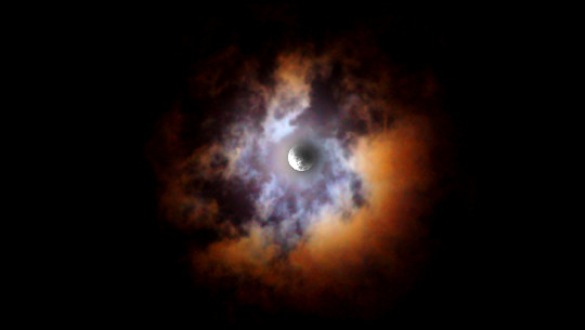 Lunar eclipse through colored clouds. Howard Cohen, November 18, 2021, Gainesville, FL