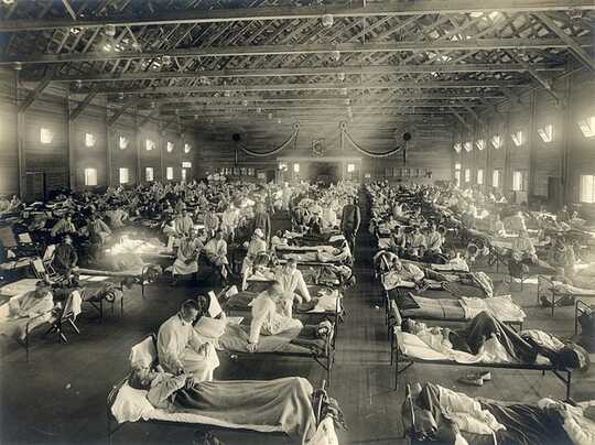 A hall of influenza patients in bed.