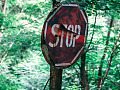 a worn and damaged stop sign